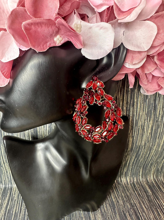 Roundish red stoned earrings.